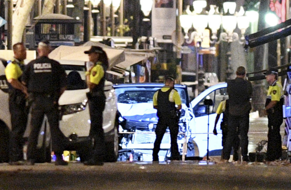 &nbsp;A damaged van, believed to be the one used in the attack, is surrounded by police officers.&nbsp;