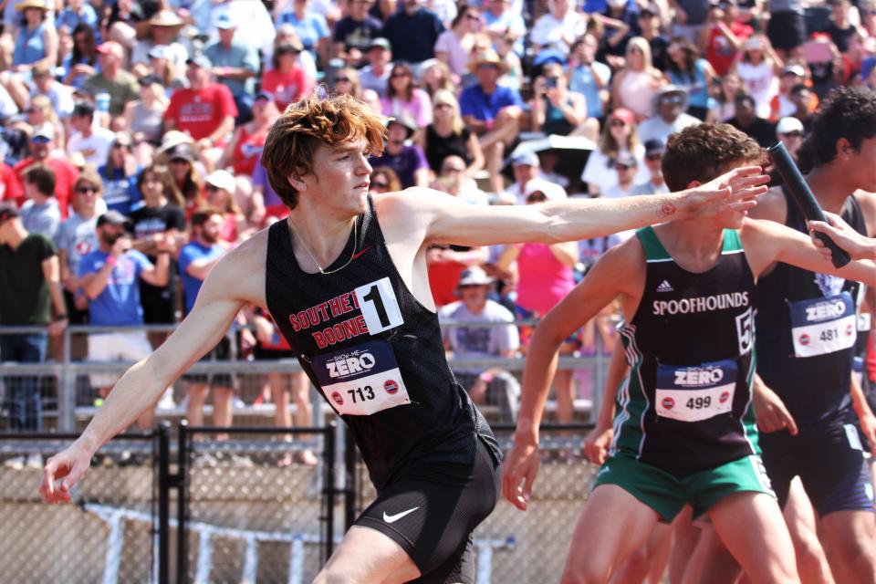 Southern Boone's Connor Burns reaches out to take the baton on the 4x800-meter relay race during the second day of the MSHSAA state track and field championship meet on May 27, 2023, in Jefferson City, Mo.
