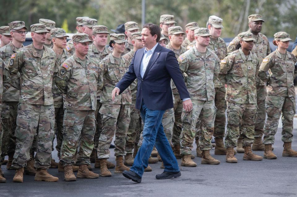 Florida Governor Ron DeSantis greets Florida State Troopers and National Guard members during a press conference in Pensacola on Friday, February 23, 2024. The Governor was in Pensacola to announce the deployment of FHP and the Guard to Texas to help secure its southern border.