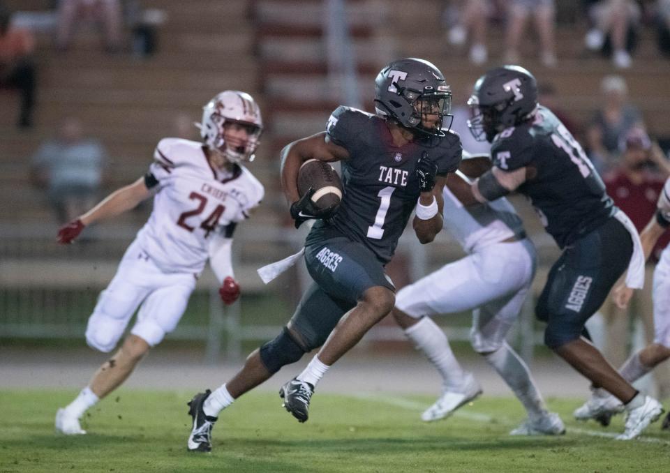Christian Neptune (1) returns a kickoff during the Northview vs Tate football game at Tate High School in Cantonment on Thursday, Sept. 7, 2023.