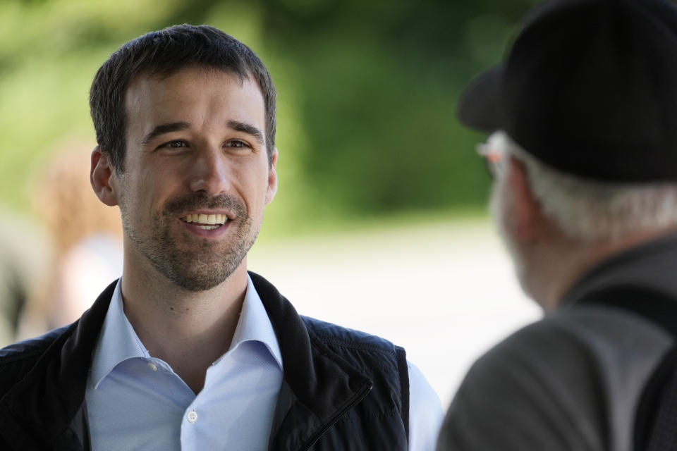 State Rep. Austin Theriault, R-Fort Kent, speaks with a voter, Tuesday, June 11, 2024, in Fairfield, Maine. Theriault is facing State Rep. Mike Soboleski, R-Phillips, in the Republican primary for the chance to try to unseat Jared Golden, one of the most conservative Democrats in the U.S. House of Representatives. (AP Photo/Robert F. Bukaty)