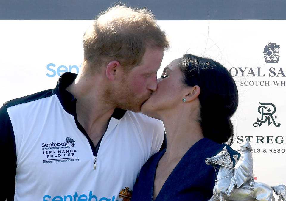 Meghan Markle and Prince Harry kiss