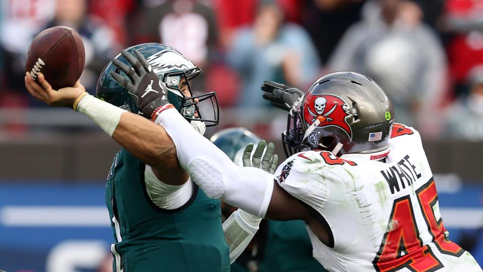 Tampa Bay Buccaneers inside linebacker Devin White (45) runs into Philadelphia Eagles quarterback Jalen Hurts (1) as he attempts a pass during the second half of an NFL wild-card football game Sunday, Jan. 16, 2022, in Tampa, Fla.