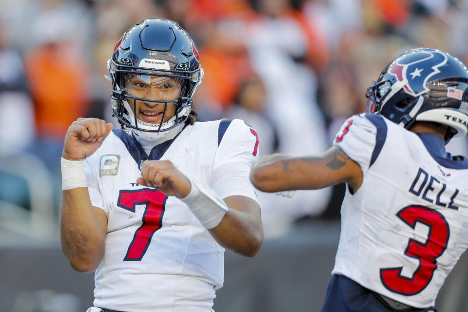 Nov 12, 2023; Cincinnati, Ohio, USA; Houston Texans quarterback C.J. Stroud (7) reacts after scoring a touchdown with wide receiver <a class="link " href="https://sports.yahoo.com/nfl/players/40097" data-i13n="sec:content-canvas;subsec:anchor_text;elm:context_link" data-ylk="slk:Tank Dell;sec:content-canvas;subsec:anchor_text;elm:context_link;itc:0">Tank Dell</a> (3) in the second half against the <a class="link " href="https://sports.yahoo.com/nfl/teams/cincinnati/" data-i13n="sec:content-canvas;subsec:anchor_text;elm:context_link" data-ylk="slk:Cincinnati Bengals;sec:content-canvas;subsec:anchor_text;elm:context_link;itc:0">Cincinnati Bengals</a> at Paycor Stadium. Mandatory Credit: Katie Stratman-USA TODAY Sports