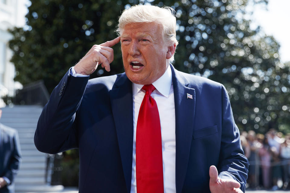 President Donald Trump talks to reporters on the South Lawn of the White House, Friday, Aug. 9, 2019, in Washington, as he prepares to leave Washington for his annual August holiday at his New Jersey golf club. (AP Photo/Evan Vucci)