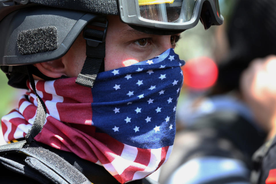 FILE - In this Aug. 4, 2018, file photo, a protester participates in a rally in Portland, Ore. Portland police are mobilizing in hopes of avoiding clashes between out-of-state hate groups planning a rally Saturday, Aug. 17, 2019, and homegrown anti-fascists who say they’ll come out to oppose them. (Mark Graves/The Oregonian via AP, File)