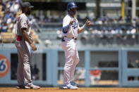 Los Angeles Dodgers' Gavin Lux, right, celebrates after his RBI-double during the second inning of a baseball game against the Cleveland Guardians in Los Angeles, Sunday, June 19, 2022. (AP Photo/Kyusung Gong)