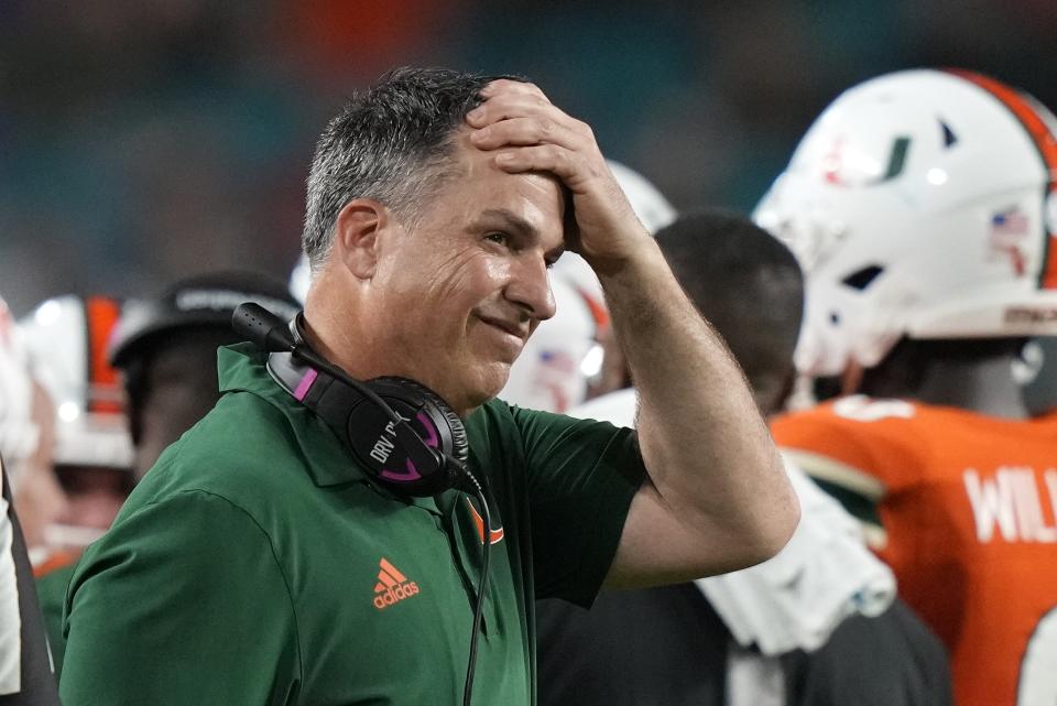 Miami head coach Mario Cristobal reacts during the first half of an NCAA college football game against Pittsburgh, Saturday, Nov. 26, 2022, in Miami Gardens, Fla. (AP Photo/Lynne Sladky)