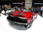 Starting with the everyday 700-hp Aventador, Lamborghini taunted the bull even further by removing the roof, adding several aerodynamic panels and generally shucking weight from a car that only had 3,472 lbs. to begin with. Even the seat fabrics have been swapped for something Lamborghini calls "Carbonskin," a fabric made from carbon fibers that's at least a decade away from being used on a teenager's hat. With no windshield, the interior has to get some form of waterproofing; the rear mirror pops up like Wall-E's head from the center of the dash. It and the roll bars behind the driver are the highest points in the car.