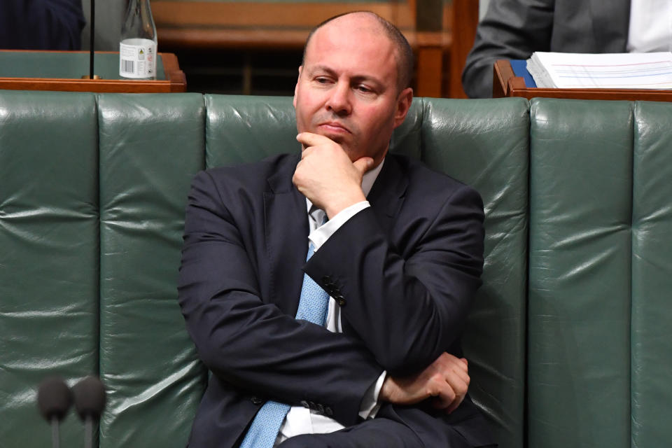 Treasurer Josh Frydenberg sits with his hand on his chin during Question Time in the House of Representatives.