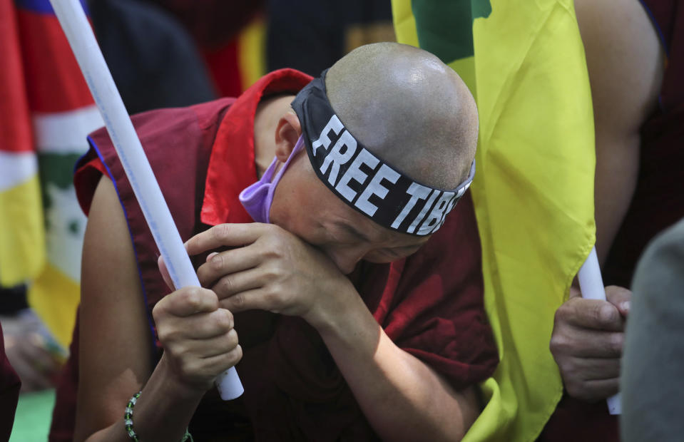 An exile Tibetan breaks down during a march to mark the 60th anniversary of the March 10, 1959 Tibetan Uprising Day, in New Delhi, India, Sunday, March 10, 2019. The uprising of the Tibetan people against the Chinese rule was brutally quelled by Chinese army forcing the spiritual leader the Dalai Lama and thousands of Tibetans to come into exile. Every year exile Tibetans mark this day as the National Uprising Day. (AP Photo/Manish Swarup)