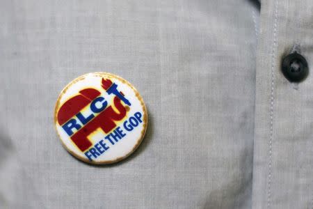 A Republican Liberty Caucus pin that reflects an intention to change the party is seen at a meeting of so-called "Liberty Kids" libertarian Republican activists in Burbank, California, July 27, 2014. REUTERS/David McNew
