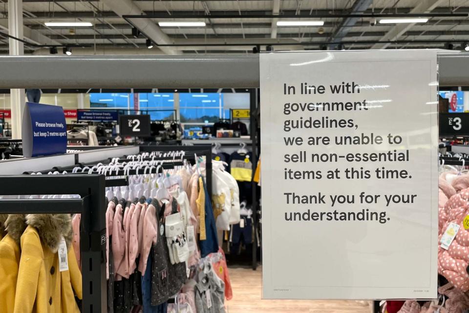 A sign in a Tesco store in Cardiff informs customers that the store is unable to sell non-essential items (Getty Images)