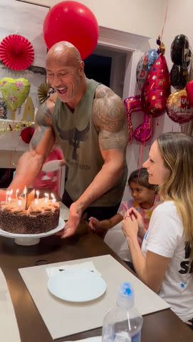 <p>therock/Instagram</p> Johnson and his daughters presented Hashian with a chocolate cake