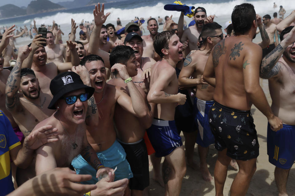 Argentine Boca Juniors fans gather on Copacabana beach the day before their team faces Brazil's Fluminense at the Copa Libertadores championship match in Rio de Janeiro, Brazil, Friday, Nov. 3, 2023. (AP Photo/Bruna Prado)