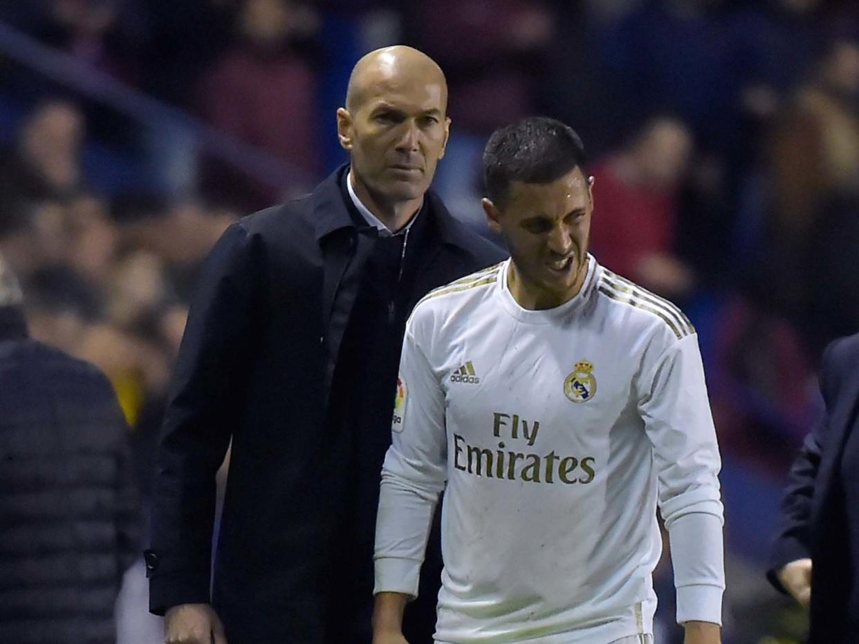 Real Madrid's Zinedine Zidane talks to Eden Hazard: AFP via Getty Images