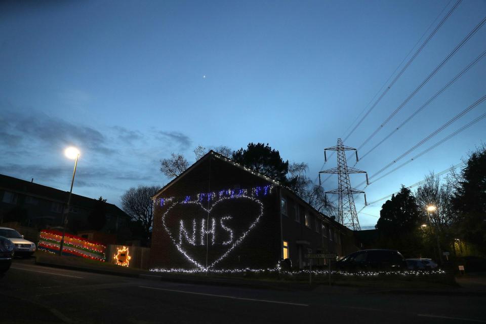 Christmas lights are used to show appreciation for the NHS on a house in Hampshire (PA)