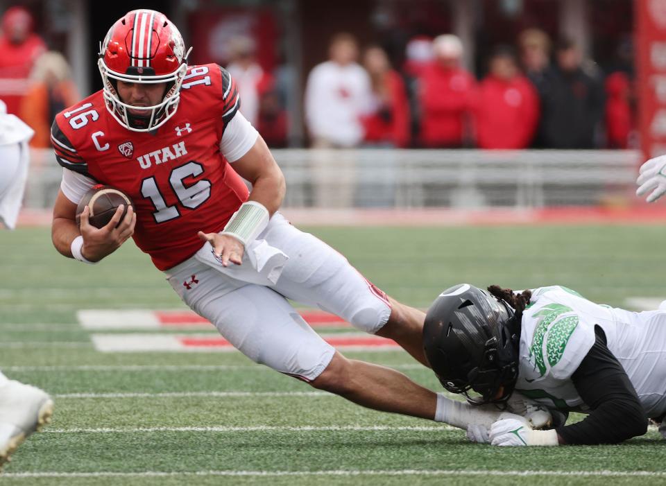 Utah Utes quarterback Bryson Barnes (16) is sacked by Oregon Ducks defensive end Brandon Dorlus (3) in Salt Lake City on Saturday, Oct. 28, 2023. Oregon won 35-6.