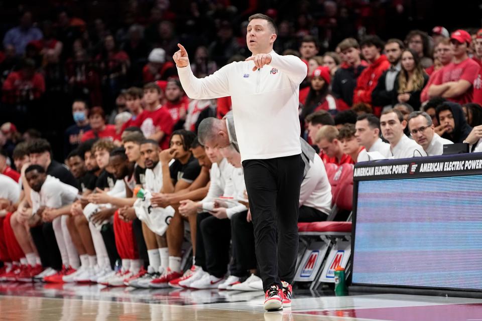 Feb 1, 2024; Columbus, Ohio, USA; Ohio State Buckeyes associate head coach Jake Diebler motions to the team from the bench during the second half of the NCAA men’s basketball game against the Illinois Fighting Illini at Value City Arena. Ohio State lost 87-75.