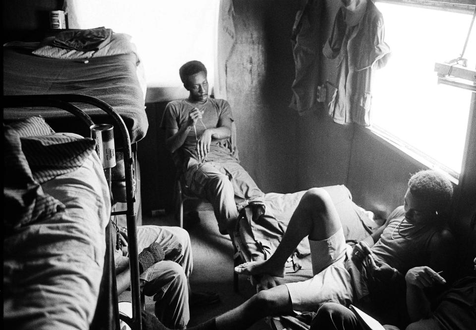 FILE - In this August 1971 file photo, American troops who are addicted to heroin sit together at a U.S. Army amnesty center in Long Binh, Vietnam. Heroin’s reputation in the 1970s was "a really hard-core, dangerous street drug, a killer drug, but there’s a whole generation who didn’t grow up with that kind of experience with heroin," said New York City Special Narcotics Prosecutor Bridget Brennan, whose office was created in 1971 in response to heroin use and related crime. "It’s been glamorized, certainly much more than it was during the '70s." (AP Photo/Neal Ulevich)