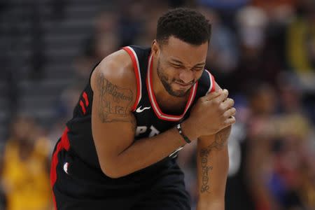 Nov 5, 2018; Salt Lake City, UT, USA; Toronto Raptors forward Norman Powell (24) reacts to injuring his shoulder in the second quarter against the Utah Jazz at Vivint Smart Home Arena. Mandatory Credit: Jeff Swinger-USA TODAY Sports