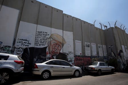 Mural depicting U.S. President Donald Trump is seen on a section of the Israeli barrier in Bethlehem, in the Israeli-occupied West Bank