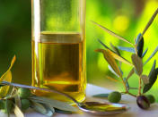 <b>Olive oil</b> <br>Like avocados, olive oil has healthy fat that increases satiety, taming your appetite. But that's hardly its only slimming feature. "Research shows it has anti-inflammatory properties," Kraus says. Chronic inflammation in the body is linked to metabolic syndrome. <br><b>Eat more</b> Drizzle your salad with olive oil and you'll increase the antioxidant power of your veggies, a study published in the British Journal of Nutrition notes. Or toss pasta with a few teaspoons of olive oil, fresh basil and sautéeed garlic, Kraus suggests. Add this oil to your summer menus for a flatter tummy by fall.