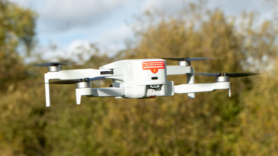 Potensic Atom in flight seen from behind with USB-C visible
