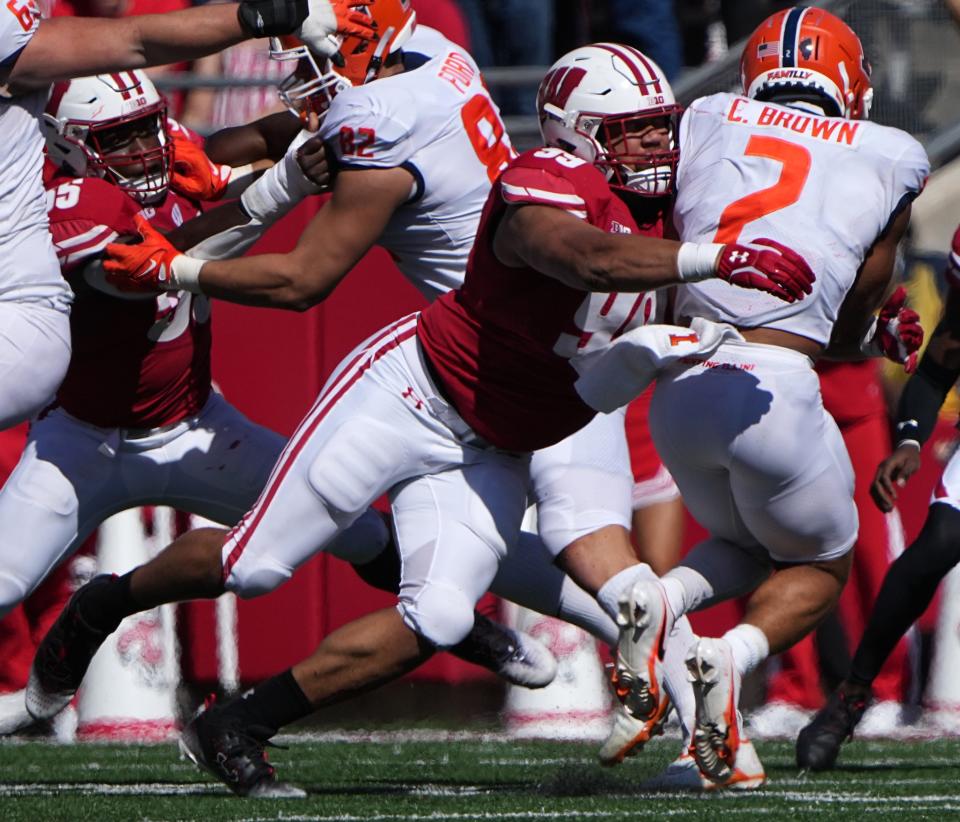 Wisconsin defensive end Isaiah Mullens, shown making a tackle against Illinois last year, has missed UW's first two games this season with a knee injury and his return to the field is uncertain.
