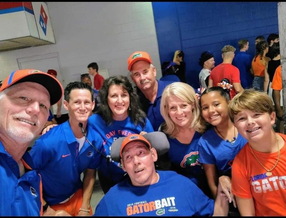 Mike Bonner's friends, who sit near him at Florida Field during Gator games, were happy UF beat South Carolina on Nov. 12: (left to right) Mike Ellison, Josh Godwin, Elizabeth Ellison,
Kevin Godwin, Angie Godwin, Payton Godwin and Jensen Godwin.