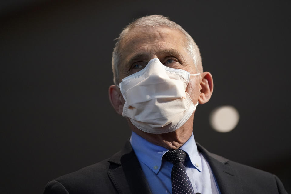 FILE - In this Dec. 22, 2020, file photo, Dr. Anthony Fauci, director of the National Institute of Allergy and Infectious Diseases, speaks before receiving his first dose of the COVID-19 vaccine at the National Institutes of Health, in Bethesda, Md. Fauci’s quick commitment to the WHO — whose response to the pandemic has been criticized by many, but perhaps most vociferously by the Trump administration — marks a dramatic and vocal shift toward a more cooperative approach to fighting the pandemic. (AP Photo/Patrick Semansky, Pool, File)