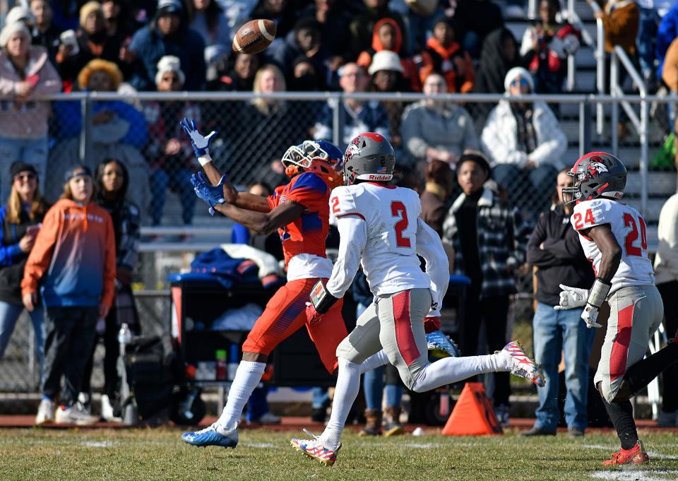 Millville's Lotzeir Brooks (17) makes a catch before scoring a touchdown against Vineland. The Thunderbolts topped the Fighting Clan 47-0 at Wheaton Field on Thursday, Nov. 25, 2021.