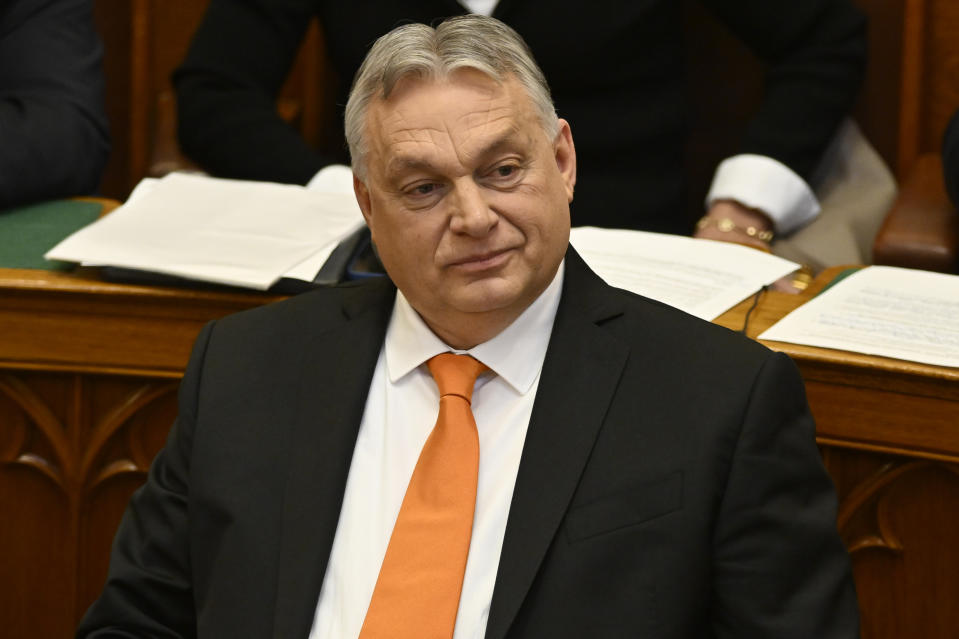 Hungarian Prime Minister Viktor Orban smiles after addressing a parliament session, on the day lawmakers are expected to approve Sweden's accession into NATO, in Budapest, Hungary, Monday, Feb 26, 2024. Hungary's parliament is to vote Monday on ratifying Sweden's bid to join NATO, likely bringing an end to more than 18 months of delays that have frustrated the alliance as it seeks to expand in response to Russia's war in Ukraine. (AP Photo/Denes Erdos)