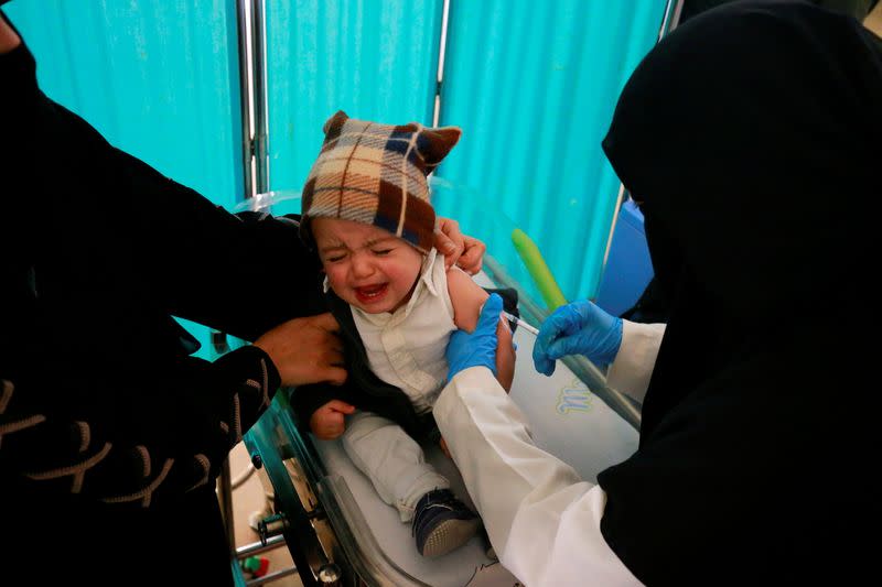 Boy cries as he is administered with a polio vaccine during a three-day immunization campaign in Sanaa