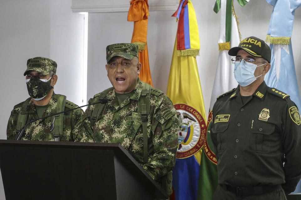 Colombian Armed Forces Commander Gen. Luis Fernando Navarro, center, National Police Director Gen. Jorge Luis Vargas, right, and Army Commander Gen. Eduardo Zapateriro give a press conference regarding the alleged participation of former Colombian soldiers in the assassination of Haiti's President Jovenel Moïse, in Bogota, Colombia, Friday, July 9, 2021. (AP Photo/Ivan Valencia)