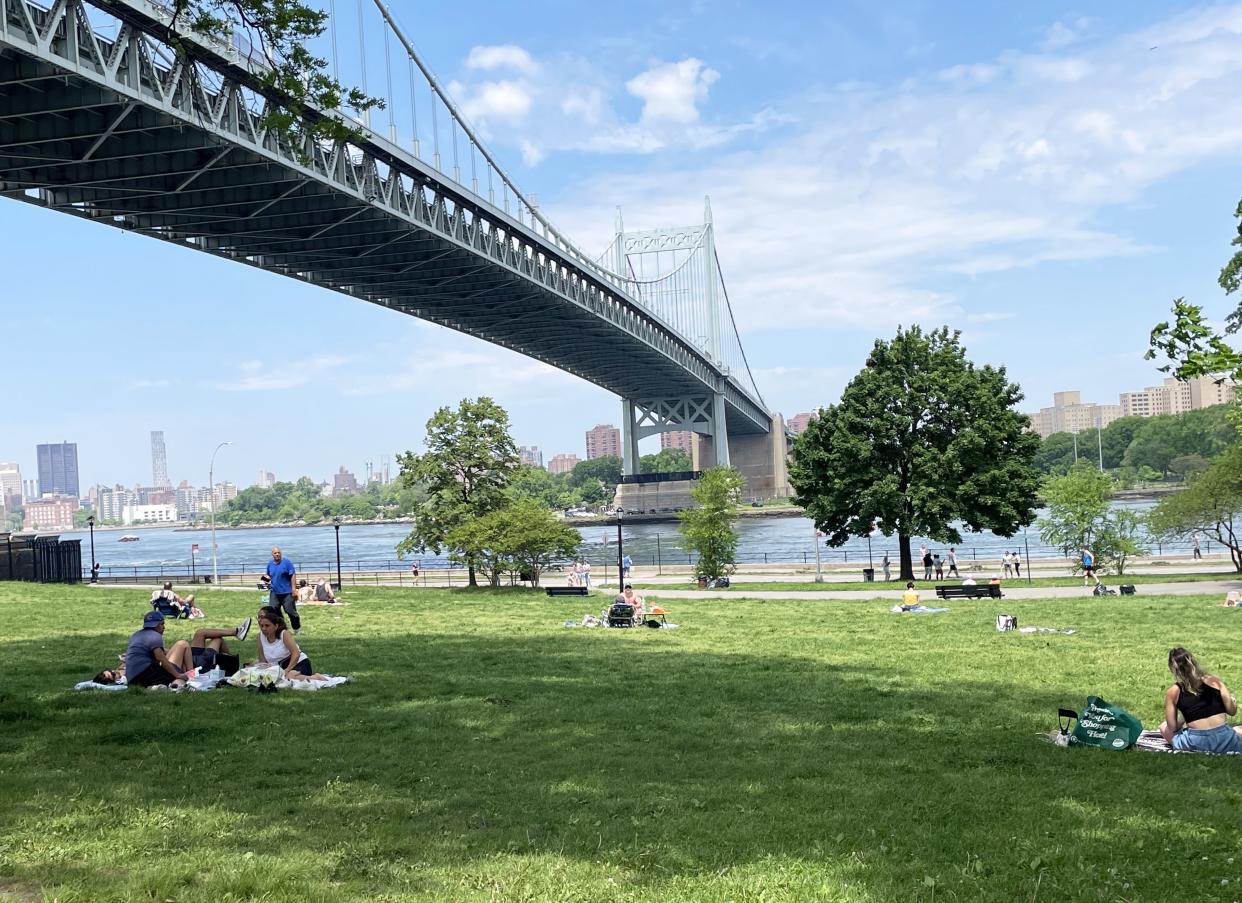 People sunbathing in Astoria Park on Sunday. 