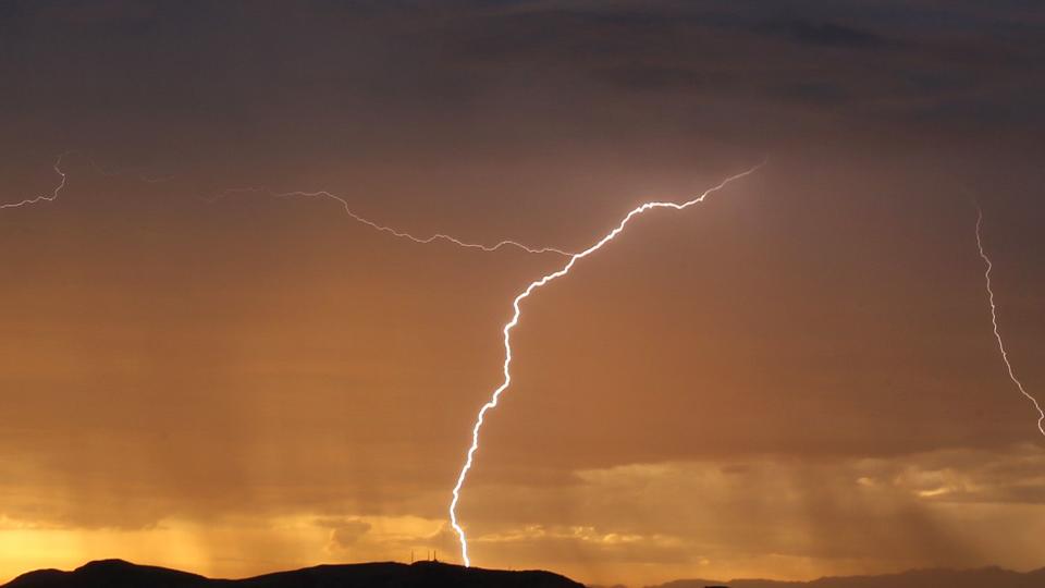 Lighting strikes to the West over the Oxnard plain as seen from Thousand Oaks as rain, thunder and lightning hit the southland by surprise Monday October 4, 2021