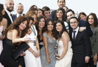 Actress Salma Hayek (front 3rd R) poses with her fans ahead of the screening of "The Prophet" movie in Beirut April 27, 2015. REUTERS/Mohamed Azakir