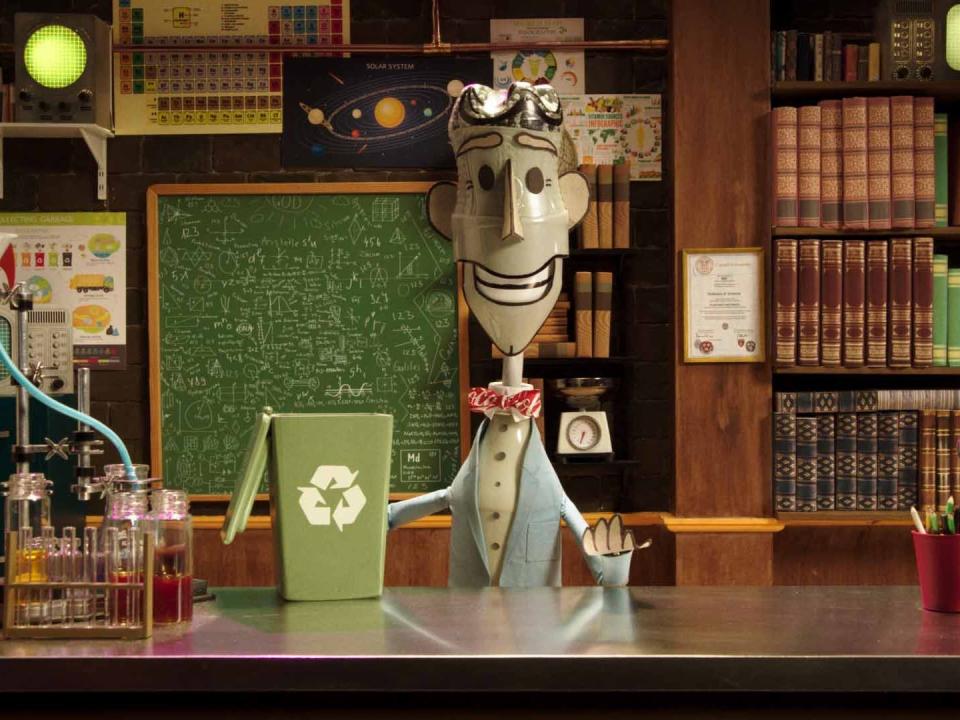 stop-motion bill nye character made out of plastic garbage in an office