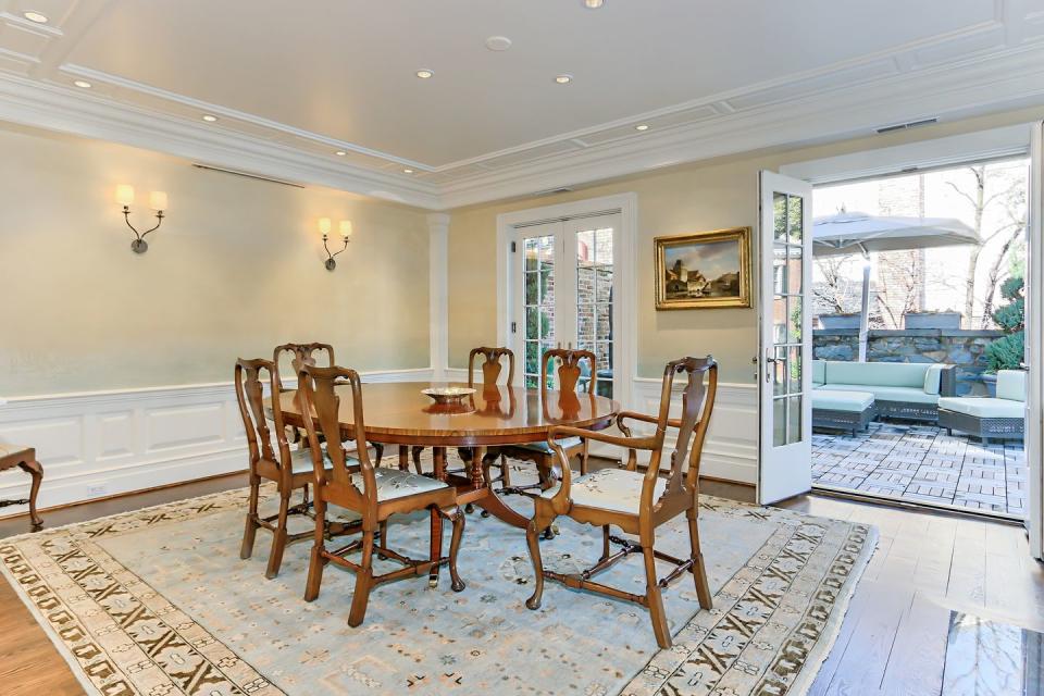 The formal dining room opens up to the outdoor patio.