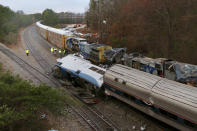 <p>Authorities investigate the scene of a fatal Amtrak train crash in Cayce, South Carolina, Feb. 4, 2018. (Photo: Tim Dominick/The State via AP) </p>