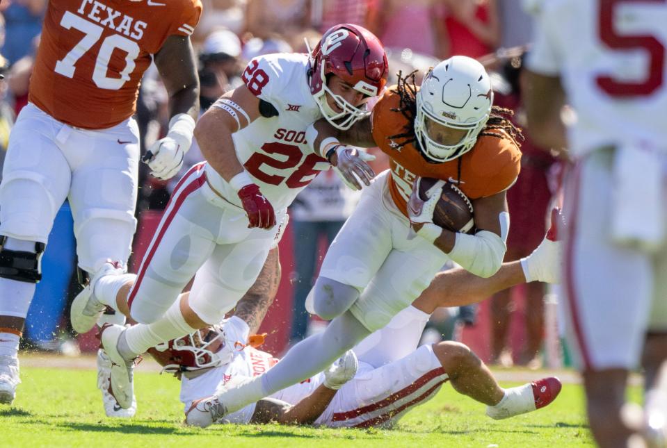 Oklahoma linebacker Danny Stutsman makes a tackle on Texas running back Jonathon Brooks during their 2023 game at the Cotton Bowl in Dallas.