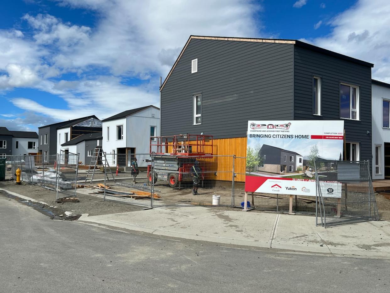 The Champagne and Aishihik First Nations construction project in Whitehorse's Whistle Bend neighbourhood, which is shown here in Nov. 2023, was designed to provide housing for 20 individuals and families in five townhomes. (Mike Rudyk/CBC - image credit)