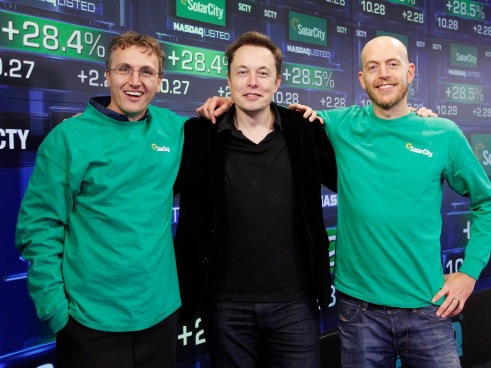 Elon Musk (center) with his cousins and SolarCity cofounders Lyndon Rive (left) and Peter Rive (right) in 2010.