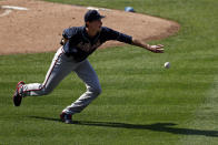 Atlanta Braves pitcher Max Fried fields a ground ball by New York Mets' Jeff McNeil during the third inning of a baseball game Saturday, July 25, 2020, in New York. (AP Photo/Adam Hunger)