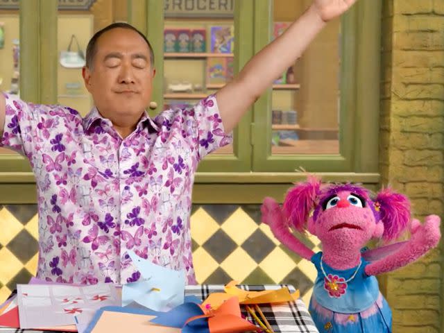 <p>Sesame Workshop</p> Abby and Alan demonstrate butterfly breathing.