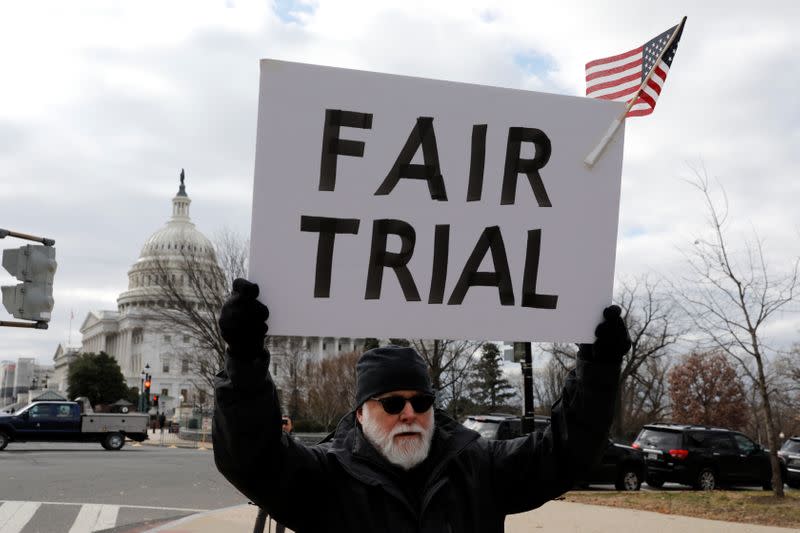 Activists rally during Trump impeachment trial on Capitol Hill in Washington