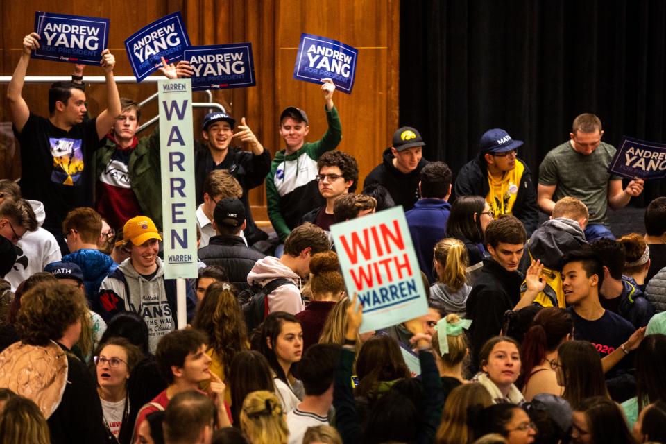 Elizabeth Warren and Andrew Yang supporters rally support while University of Iowa students caucus, Monday, Feb. 3, 2020, at the Iowa Memorial Union in Iowa City, Iowa.