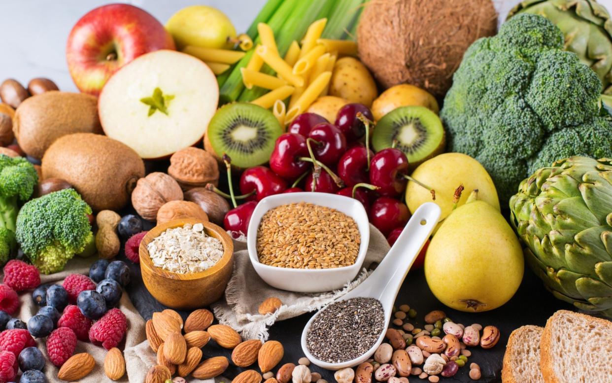 A selection of fruits, vegetables, nuts and other vegan foods