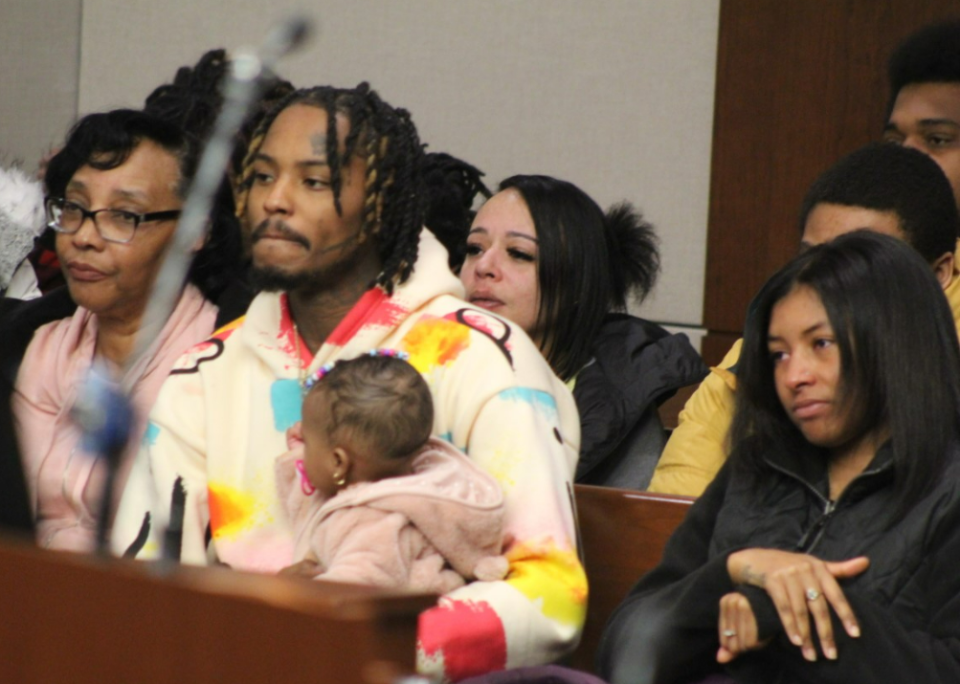 Jayleigh Myers, 9 months, sits in the lap of an unidentified man among relatives and friends of Johnathon Myers who attended his sentencing Monday in Delaware County Common Pleas Court, where he was ordered to prison for 25 years in connection with a March 11 shooting spree along Interstate 71 near Polaris in Delaware County. No one was injured, though Myers struck at least three civilian vehicles and a Columbus police cruiser. 
(Photo: Dean Narciso)